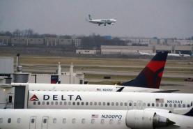 Delta says it lost $3.4 billion in 2021, but expects 'strong' spring and summer travel